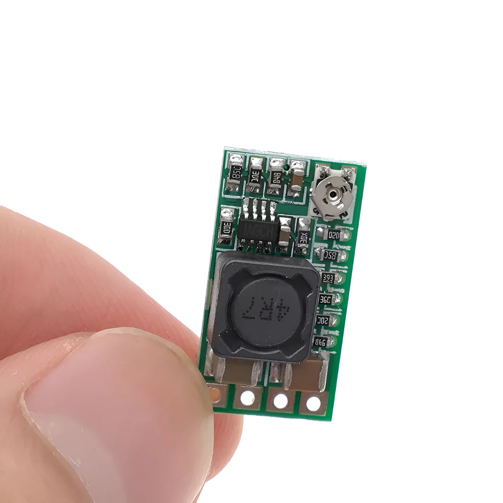Green 25x21mm DC-DC buck converter module for 12-24V to 5V conversion