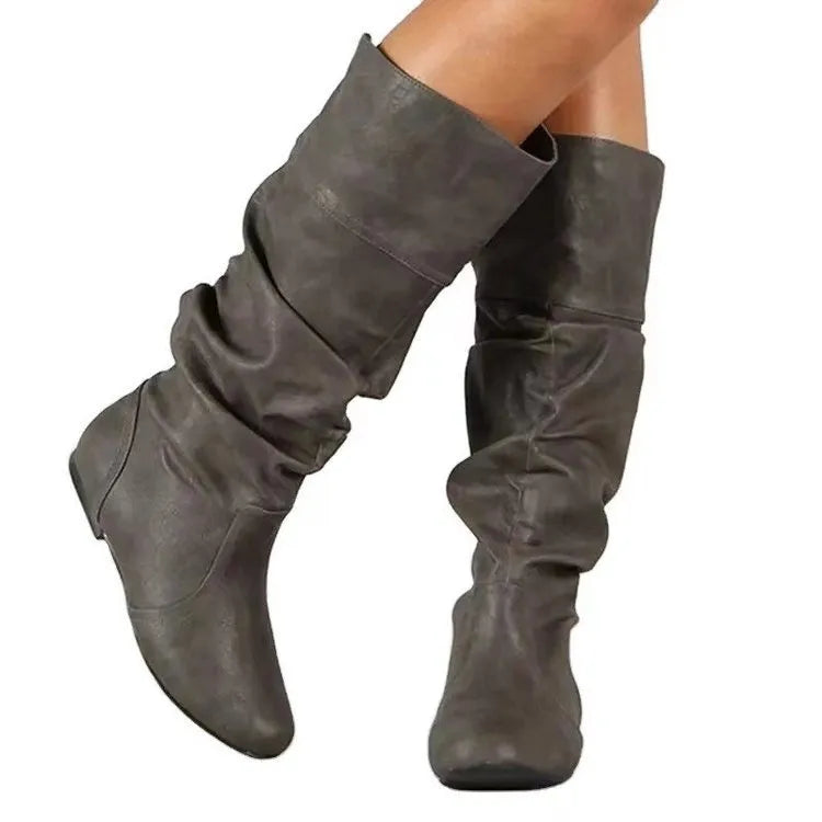 Women's flat slip-on ankle boots in artificial PU with a round toe and high cylinder design