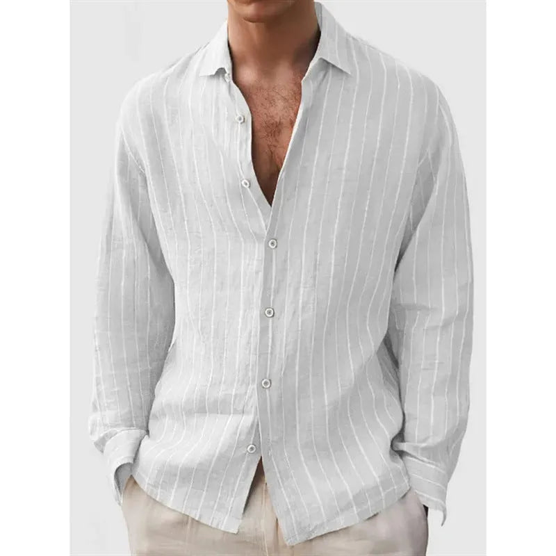 Man wearing a loose fit, short sleeve, striped cardigan shirt in a casual setting.