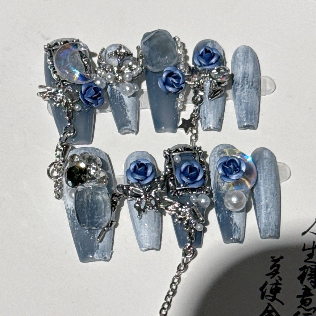 Blue false nails with rose and flower pattern, shown in a set with sizes XS, S, M, L.