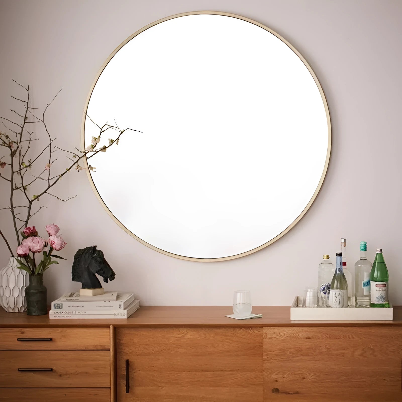 Round iron-framed bathroom wall mirror in black, gold, or white finish