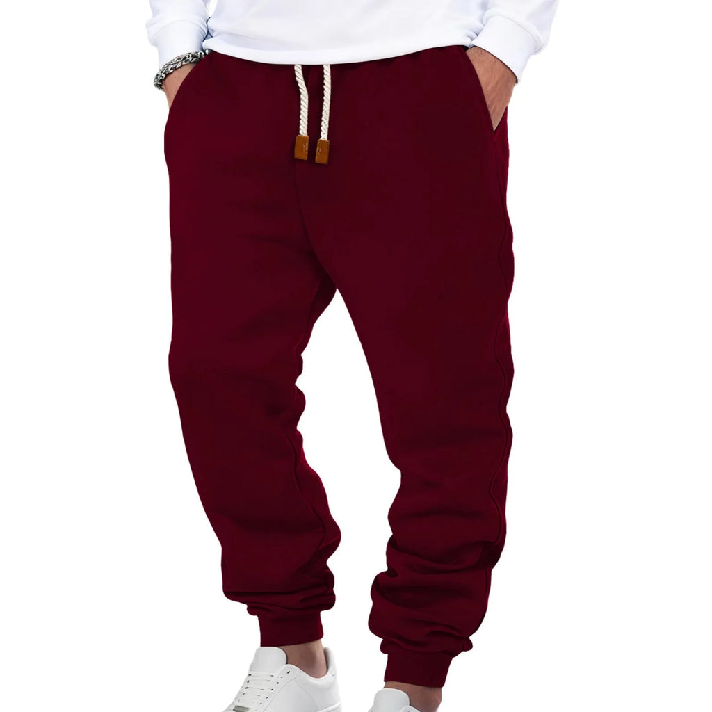 Men's solid colour fleece-lined cuffed sweatpants in army green with drawstring waist