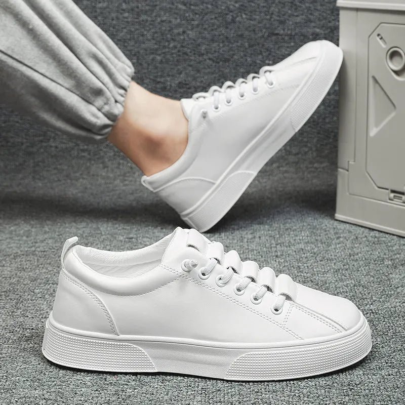 Men's black and white low top sports shoes with synthetic leather upper and PVC sole