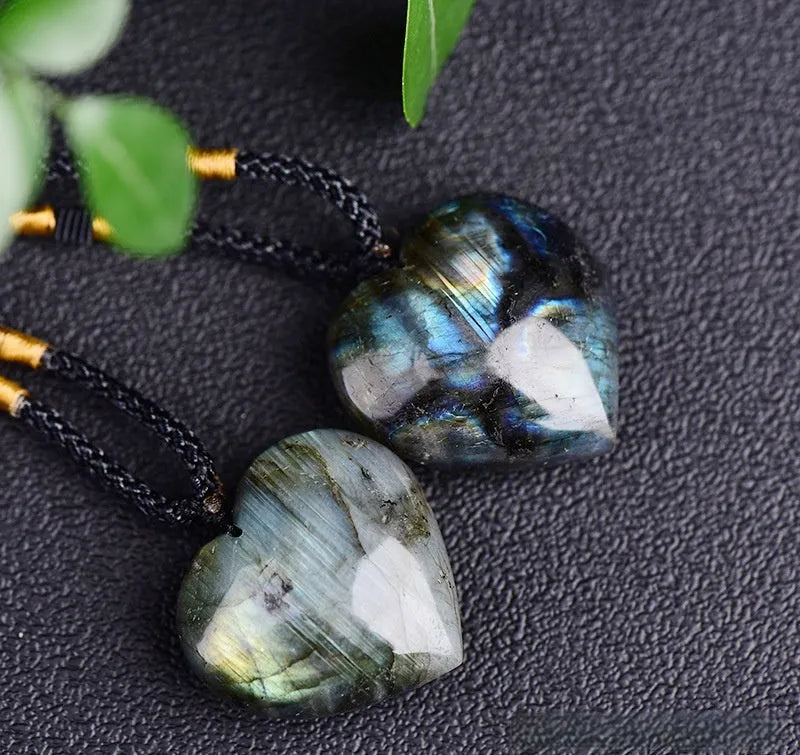 Blue natural Labradorite and Moonstone geometric heart of the ocean pendant necklace on a chain.