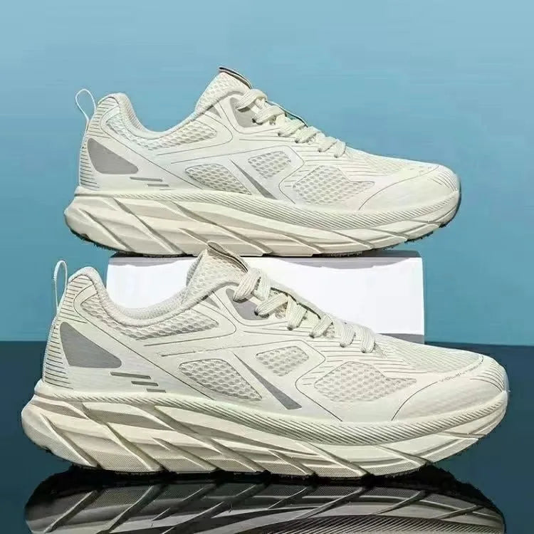 Pair of beige mesh casual running shoes with round toe and plastic sole on a white background.