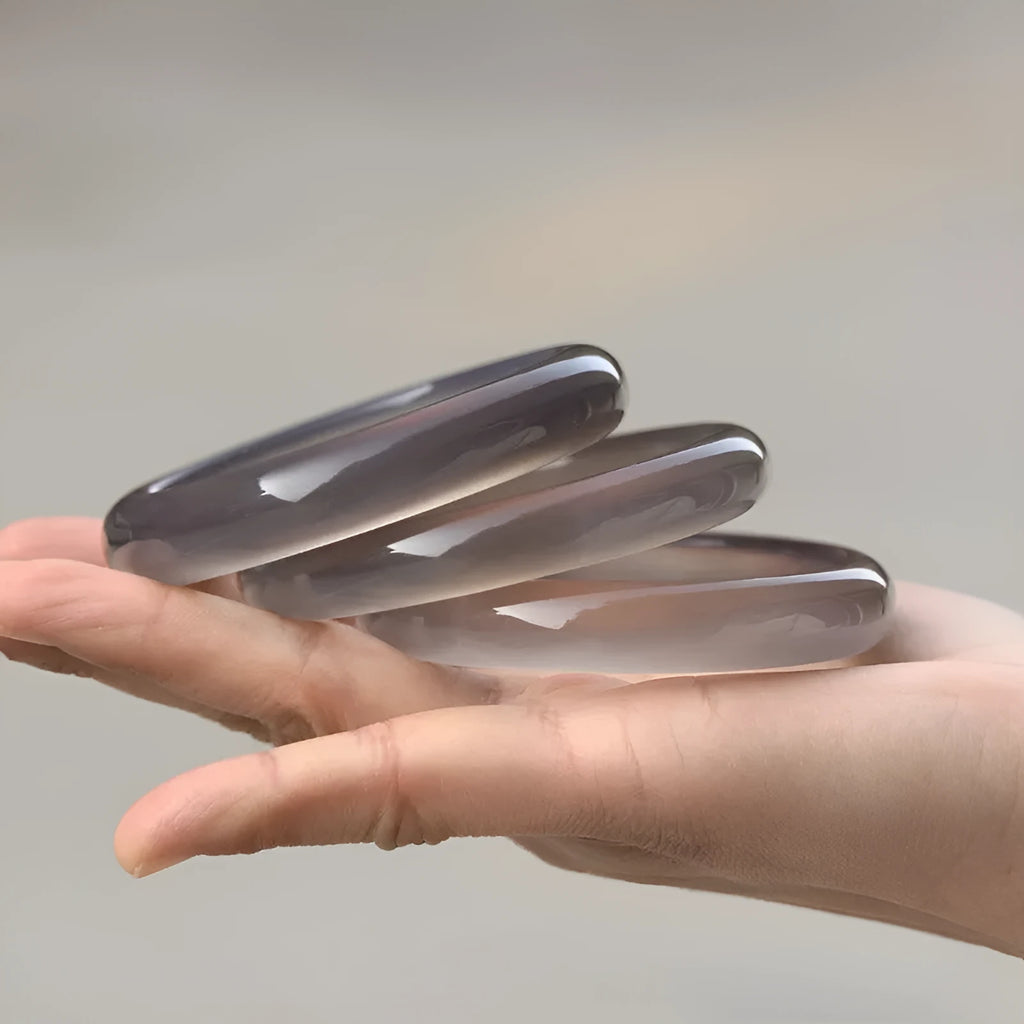 Women's dark grey Brazilian agate bracelet with natural iced chalcedony patterning and circular design elements
