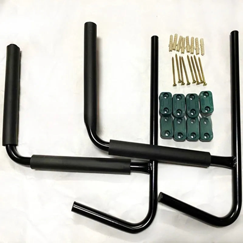 Carbon steel kayak and surfboard wall hanger storage rack mounted on a wall.