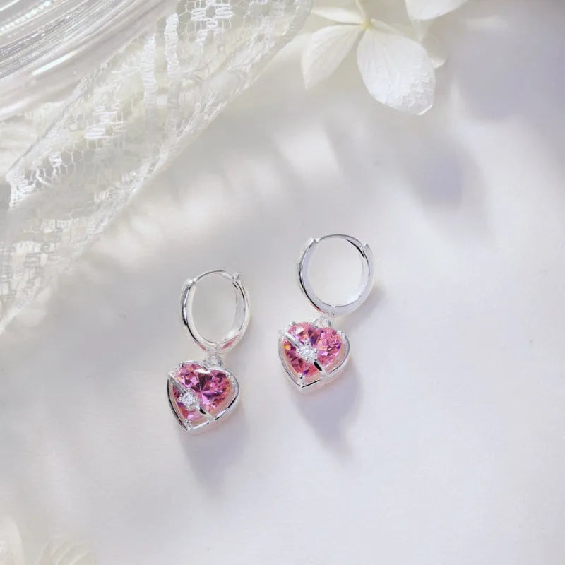 S925 sterling silver heart shaped earrings for women in pink electroplated finish on white background