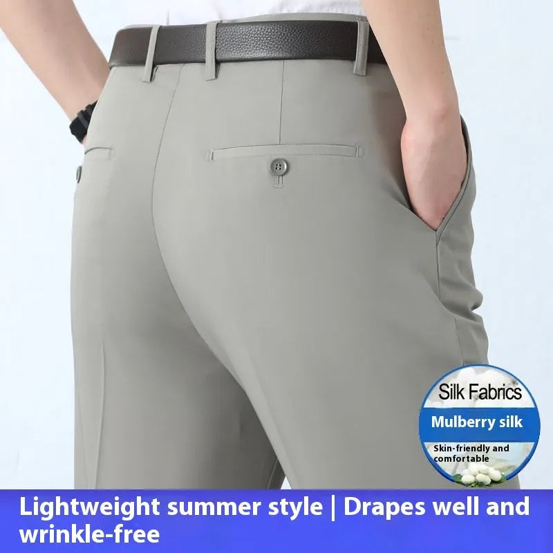 Men's straight-leg suit trousers in mulberry silk fabric on a hanger