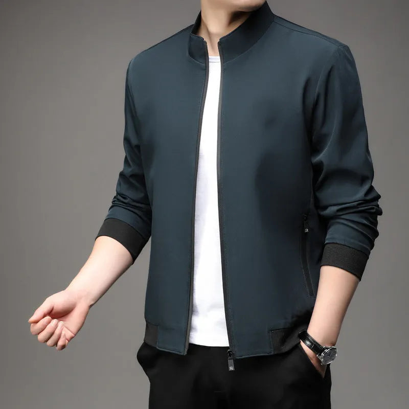 Korean style loose fit autumn jacket in navy blue with zippered pockets on a hanger