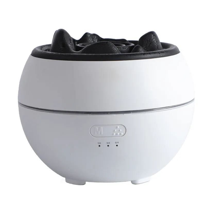 White round flame aroma diffuser humidifier with water tank and timer controls on a desk.