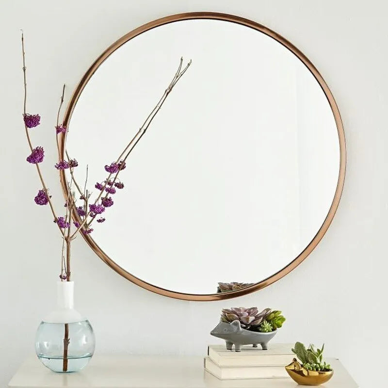 Round iron-framed bathroom wall mirror in black, gold, or white finish