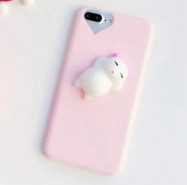 Soft pink TPU silicone iPhone case with a raised 3D cartoon cat design on the back.