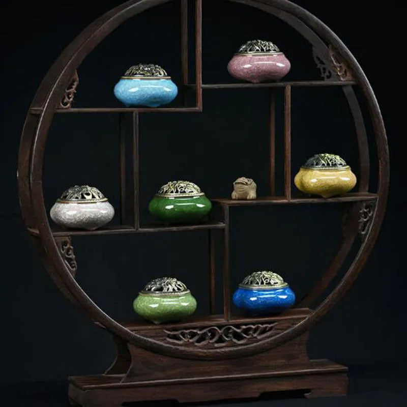 Ceramic incense burner in choice of twelve colours, shown next to incense sticks.