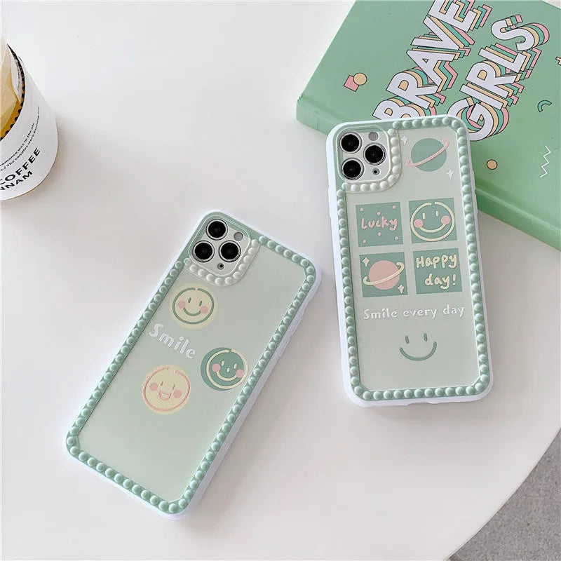 Green TPU iPhone case showing geometric smiley face design with polka dot frame on back