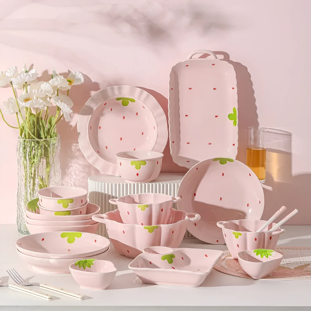 Porcelain dinnerware set with strawberry pattern includes bowls, plates, and spoon