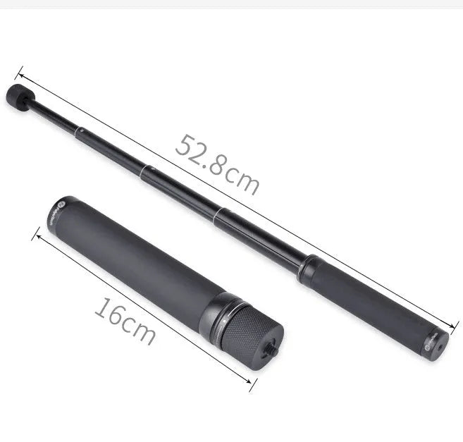 Black retractable selfie stick extended to full length with phone attached, showing detachable tripod legs and wireless remote.