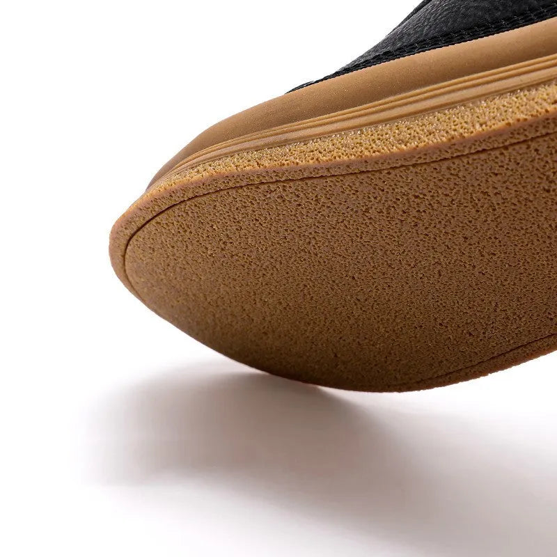 Men's black casual leather shoes with a round toe and lace-up front on a white background.