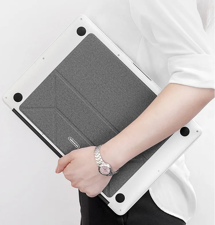 Blue portable laptop cooling bracket with foldable design on a wooden table.