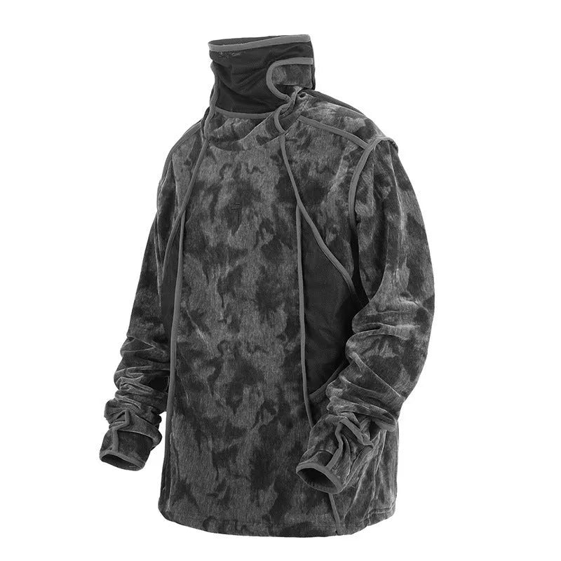 Man wearing a black tie dye print loose pullover sweater with drop-shoulder sleeves.
