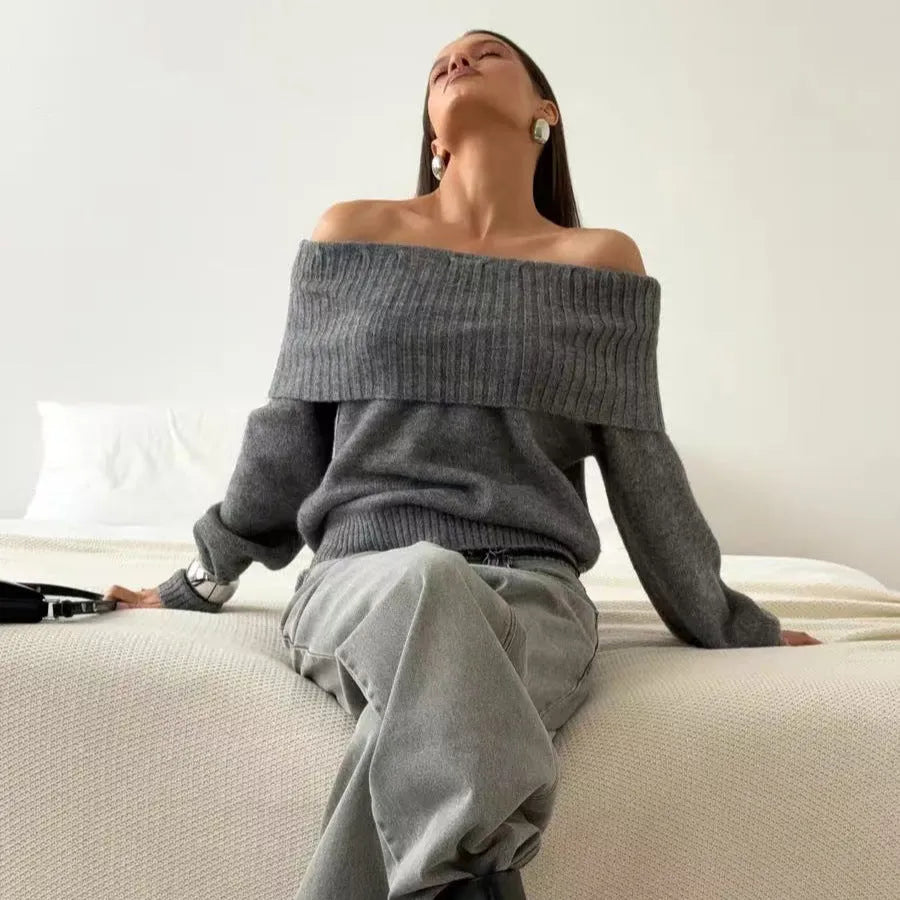 Grey off-the-shoulder strapless women's sweater with a 3D textured pattern.
