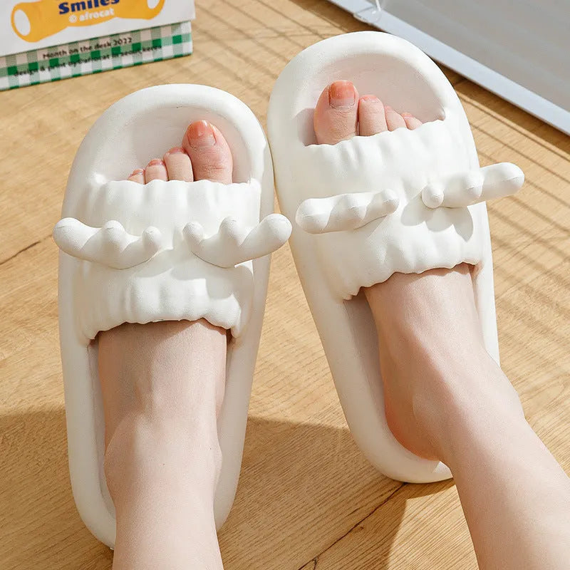Deer horn patterned EVA flip flops for couples on a white background.