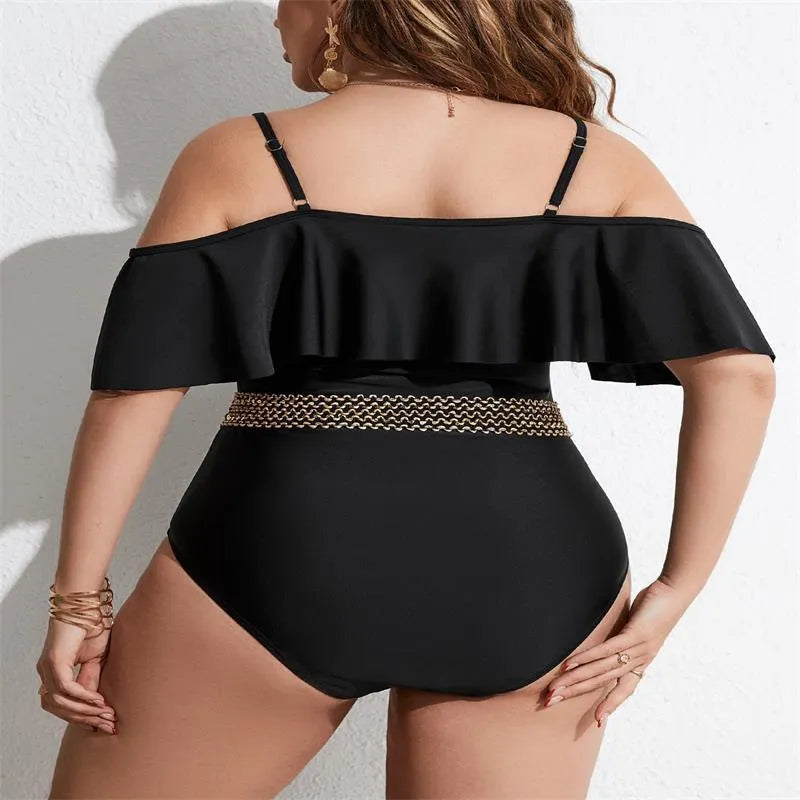 Black solid colour women's one-piece swimsuit on a hanger, polyester fabric, for swimming.