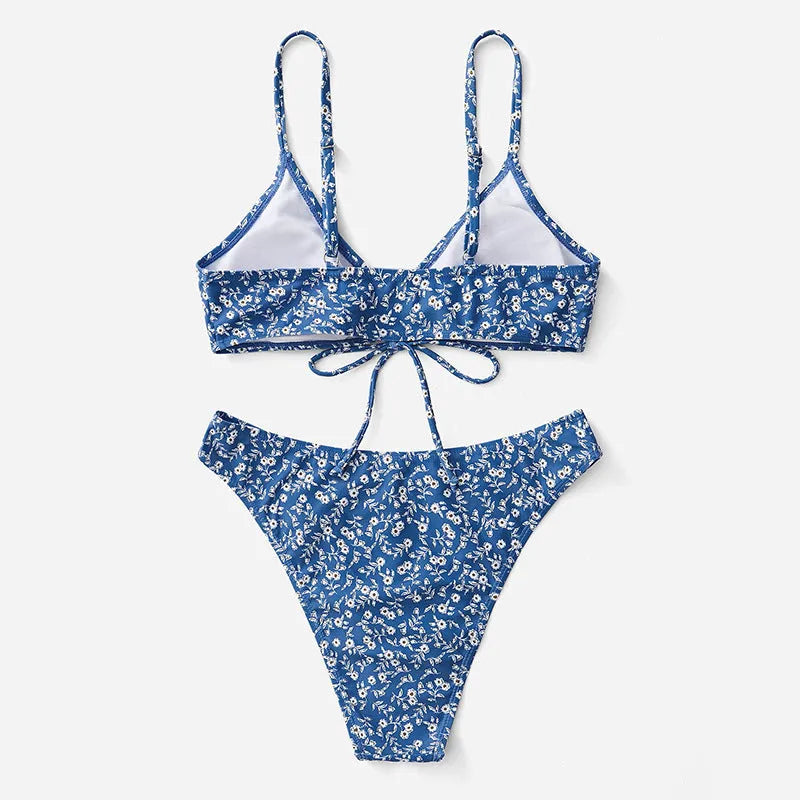 Blue women's swimsuit three-piece set with halter top and shorts on a mannequin.