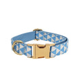 Blue cloth dog collar, leash, vest, and bow set with triangular ring rope design on a white background.