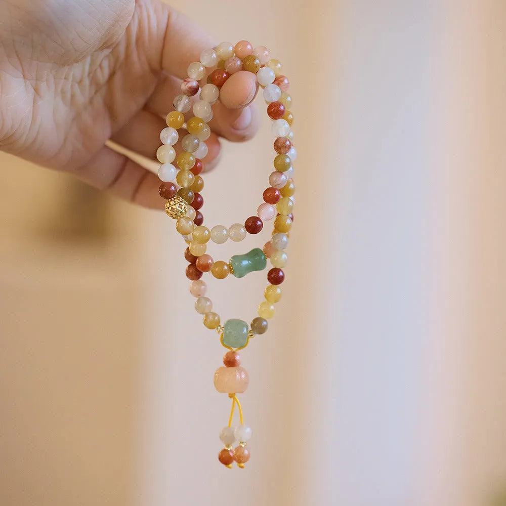 Women's handcrafted three-circle pumpkin tassel bracelet in Jinsi Jade