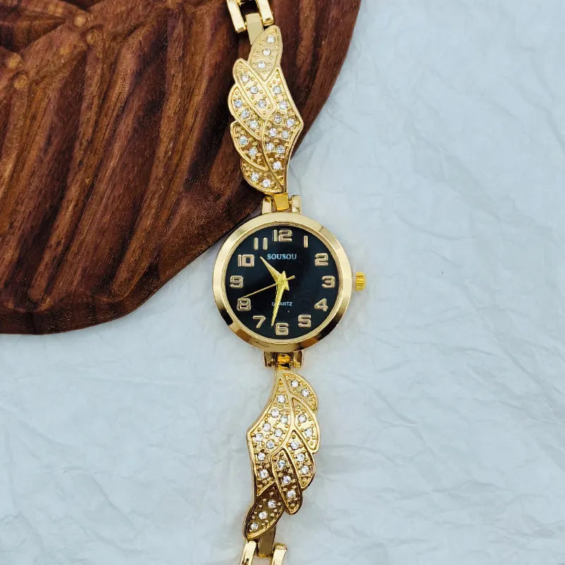 Women's round stainless steel watch with a choice of gold, golden white, or golden black dial on a steel strap with vachette clasp.