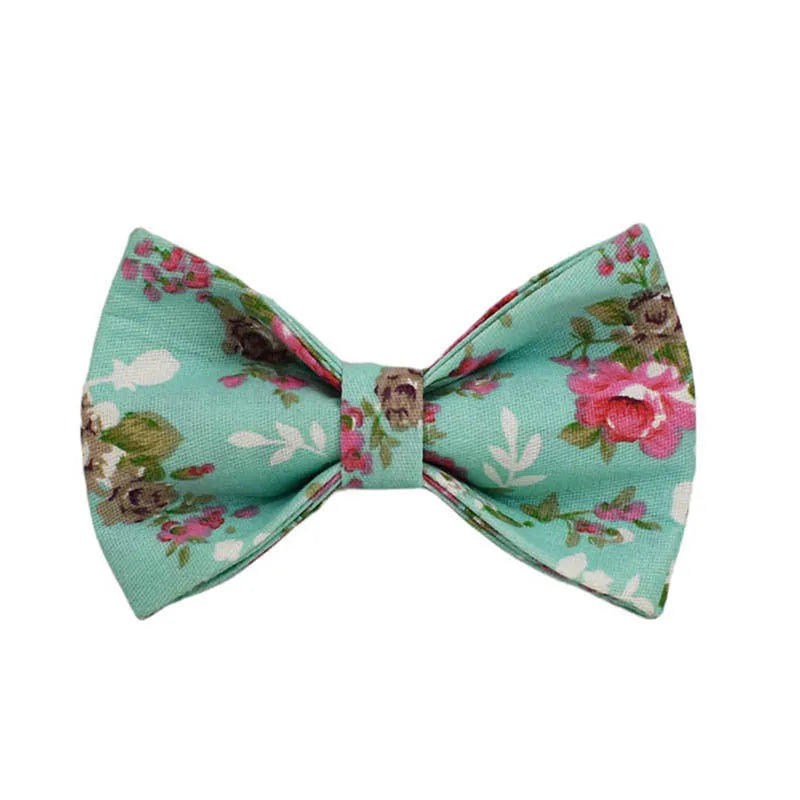 Rose pattern dog collar set on green background with detachable bow and matching leash
