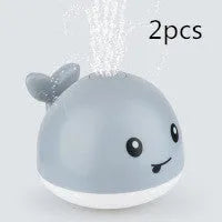Automatic water spray whale bath toy with LED lights for baby sensory play