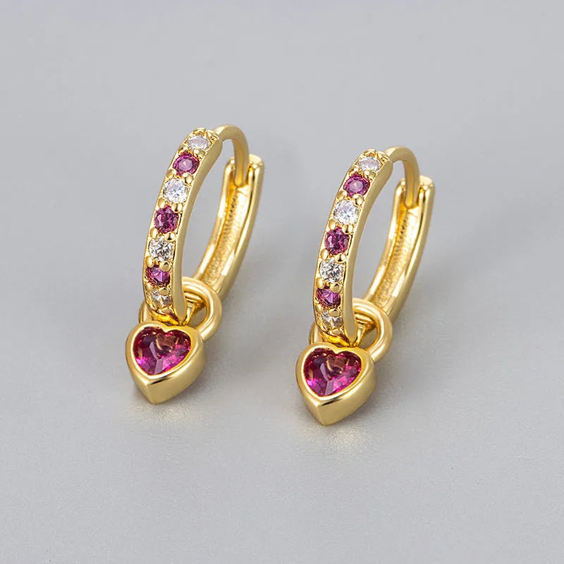 Women's heart-shaped drop earring with a dangling coloured stone, available in gold or white gold plating.