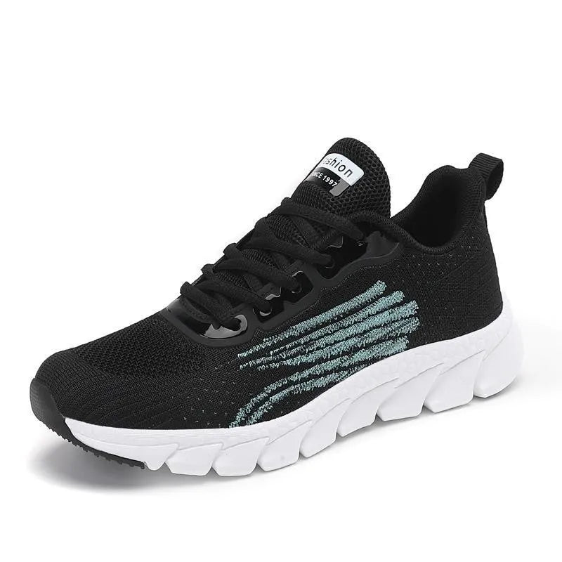 Flat running sneakers with cross-strap detail in black or white colours