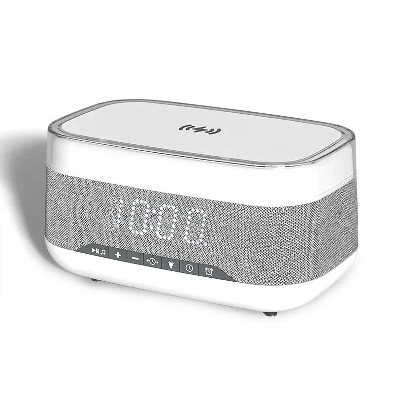 White alarm clock with wireless charging surface and Bluetooth speaker functionality for bedside use