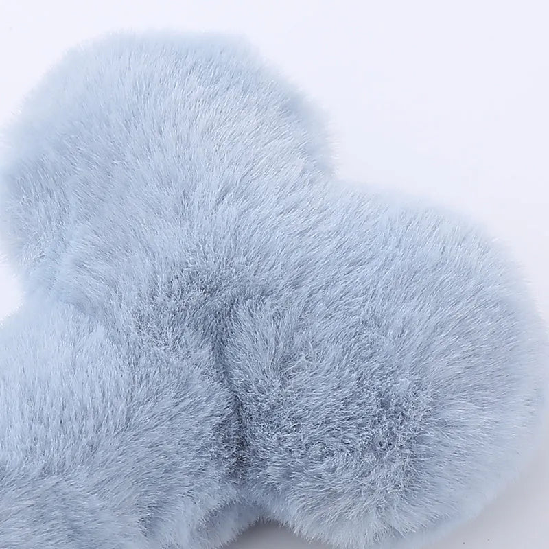Bone-shaped plush dog toy with squeaker in blue, pink, and yellow colour options
