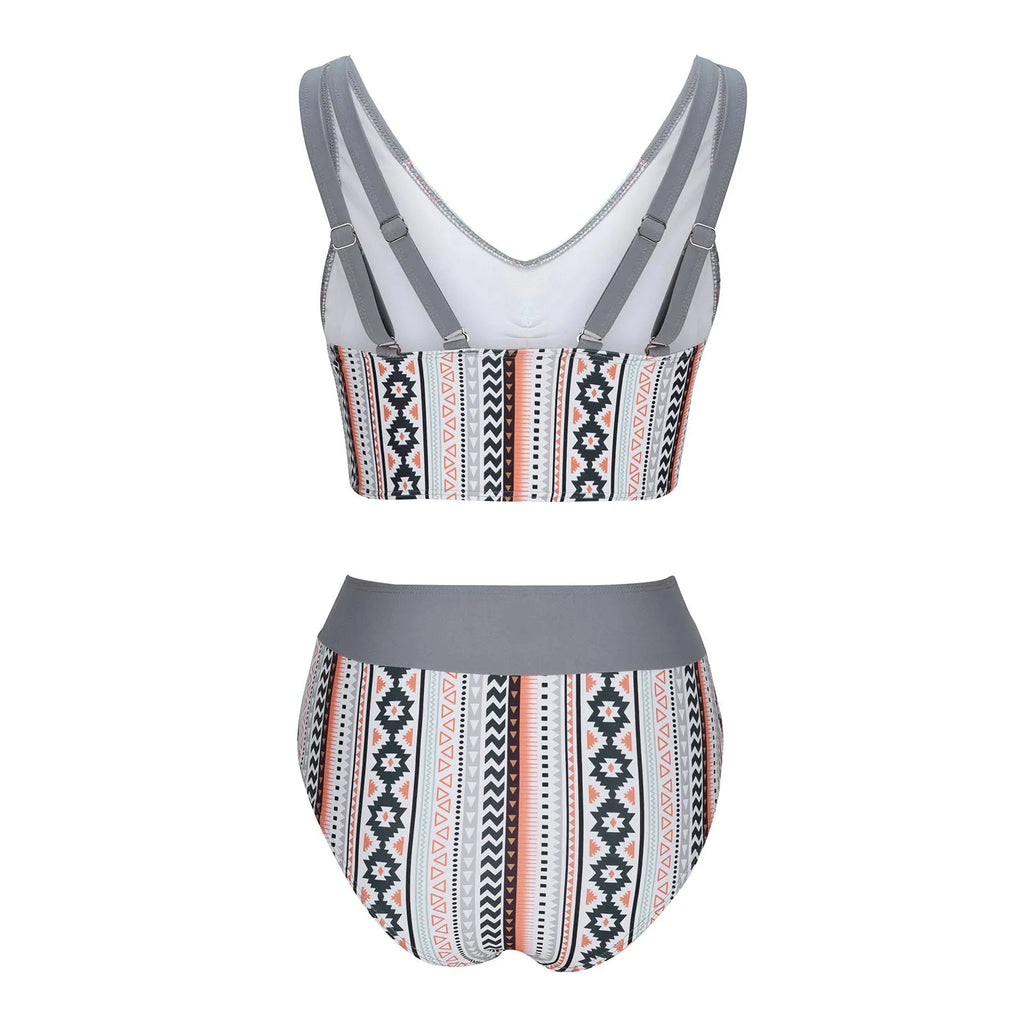 Blue women's cross sling split swimsuit with briefs cut on model