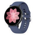 Black smart bracelet watch with touch screen displaying heart rate and call icons on a wrist.