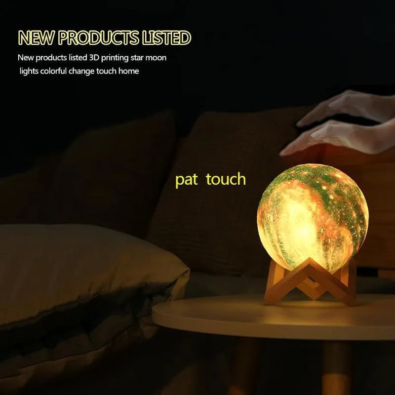 3D printed spherical lunar lamp with colour changing LED light on a surface.