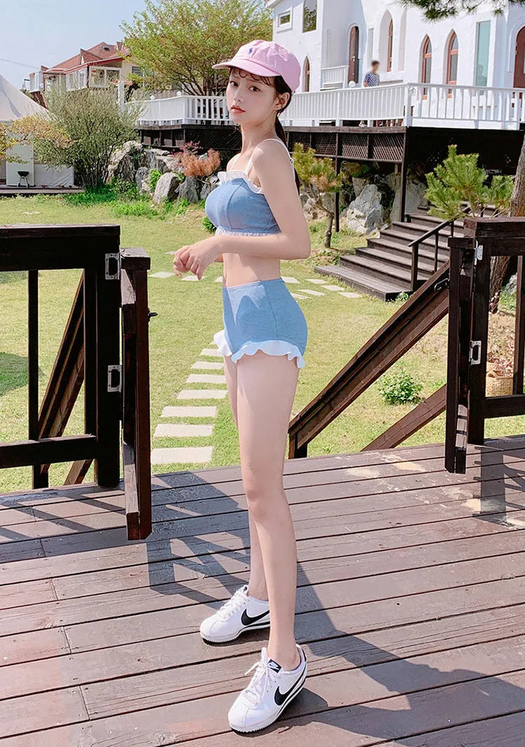 Solid colour conservative one-piece swimsuit for women with adjustable suspenders.