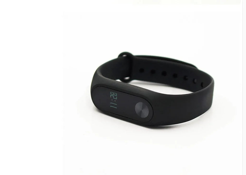 Black Xiaomi Mi Band 2 smart wristband with OLED screen on a textured thermoplastic elastomer strap.