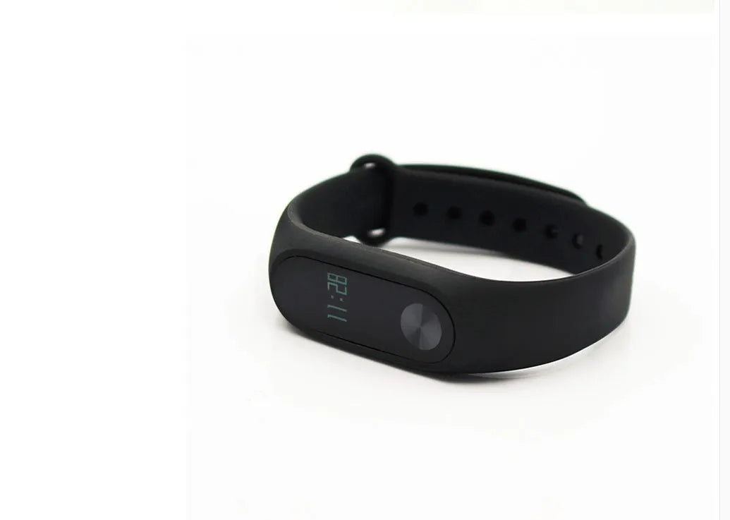 Black Xiaomi Mi Band 2 smart wristband with OLED screen on a textured thermoplastic elastomer strap.