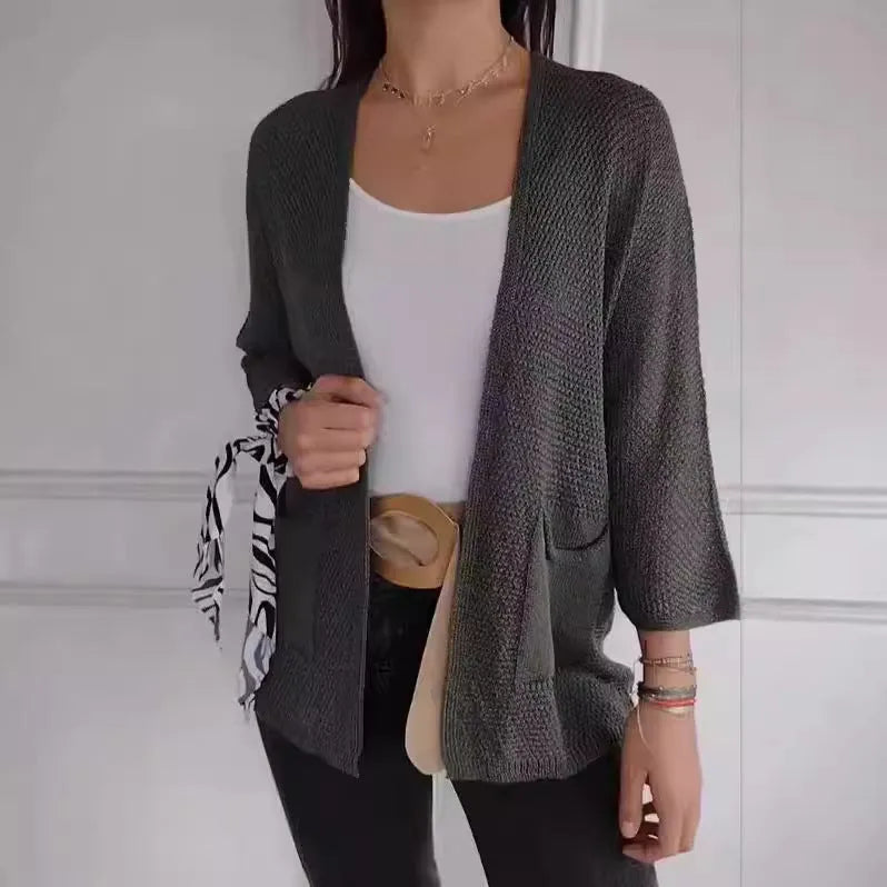 Women's waffle knit cardigan coat in apricot colour with nine-quarter sleeves and side pockets