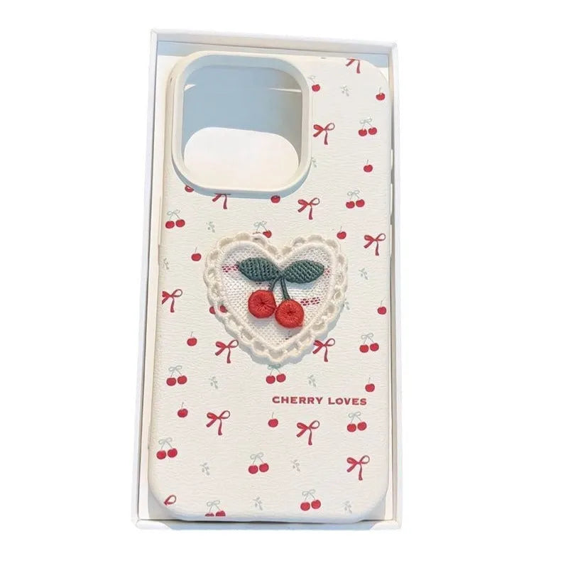 Cherry embroidered silicone iPhone case in litchi pattern white with three-dimensional raised embroidery design