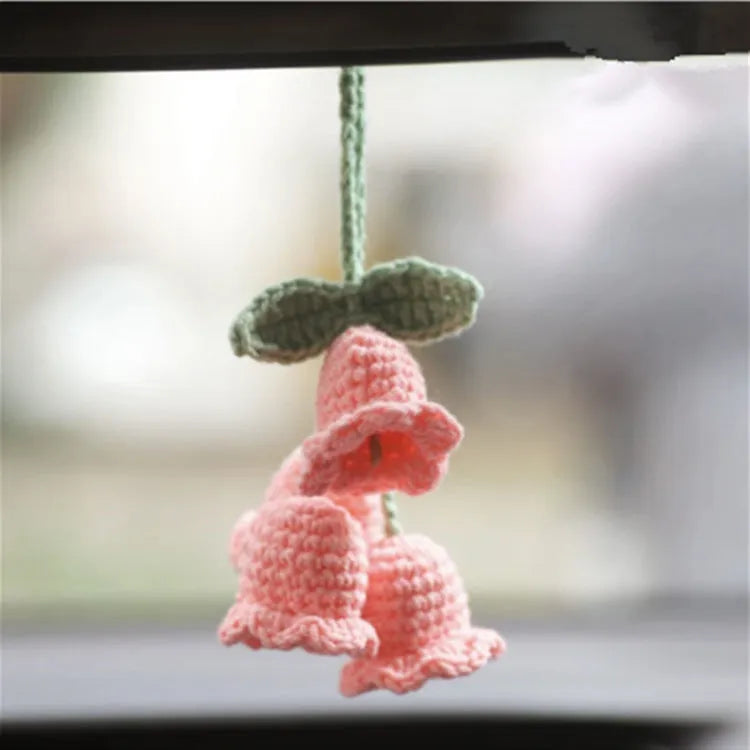 Green and white knitted wool car plant decoration with 8cm base and hanging rope.
