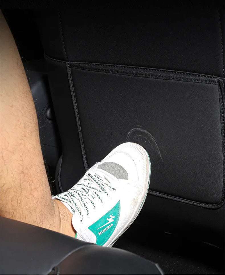 Black leather rear anti-kick pad for motorbike seat, showing single-pocket style.