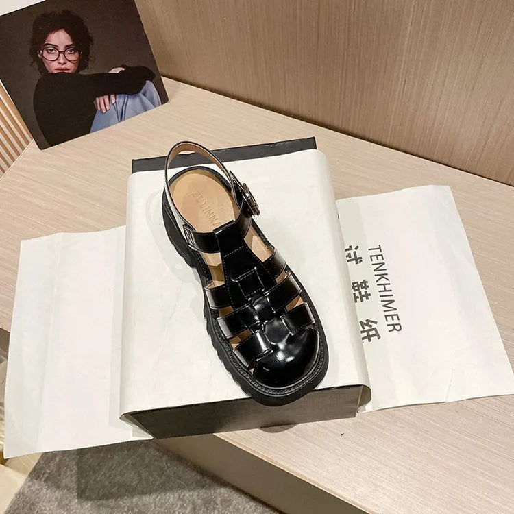 Women's black retro platform sandals with chunky heel, round toe, and adjustable buckle strap.