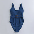 Navy blue women's slim-fit one-piece swimsuit with triangle top and removable padding.