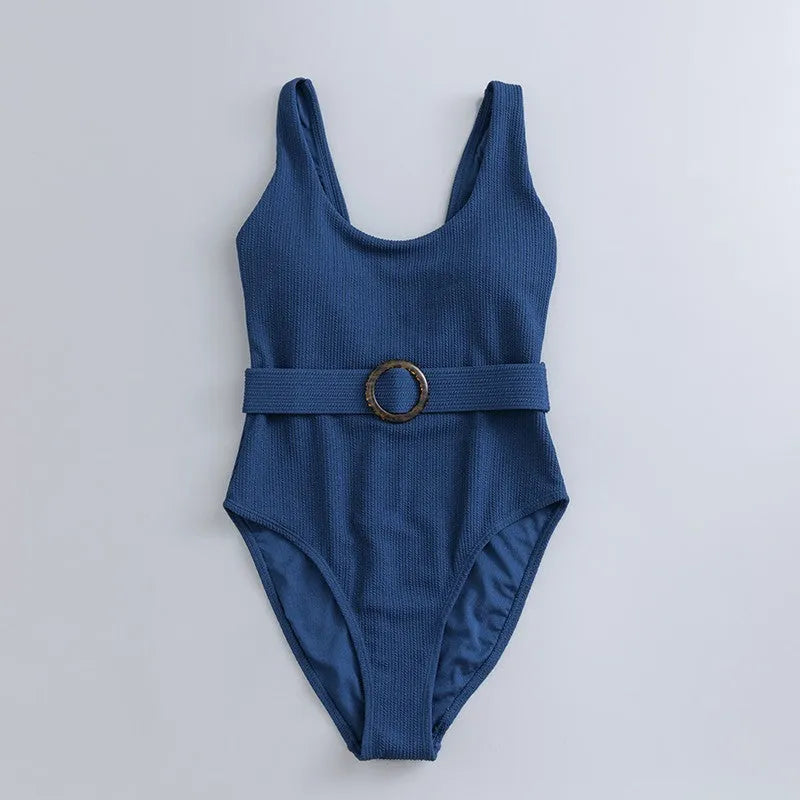 Navy blue women's slim-fit one-piece swimsuit with triangle top and removable padding.